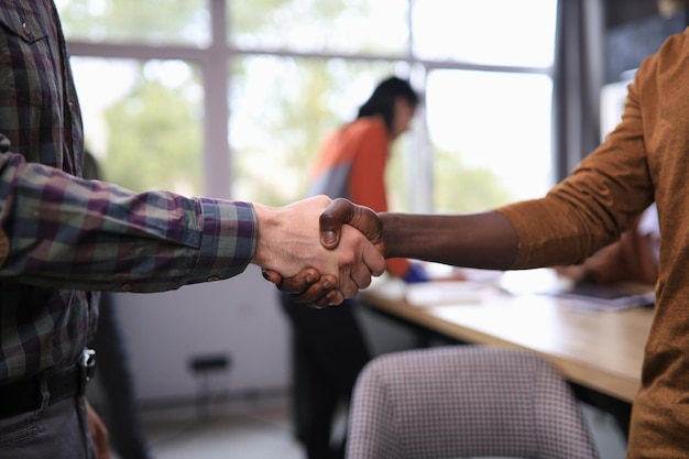 Business people shaking hands in office