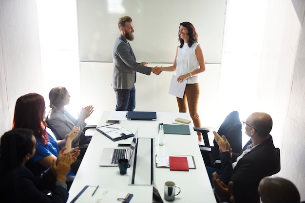 Business people shaking hands together