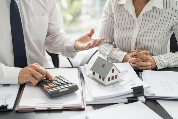 Business people signing contract making deal with real estate agent Concept for consultant home insurancexAReal estate investment Property insurance security Real estate agent