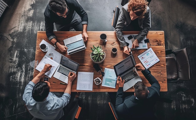 Photo business people sit at a table