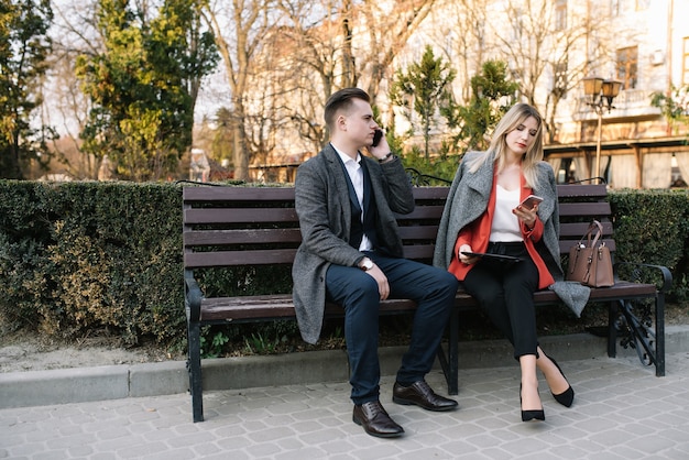 Business people sitting on a bench