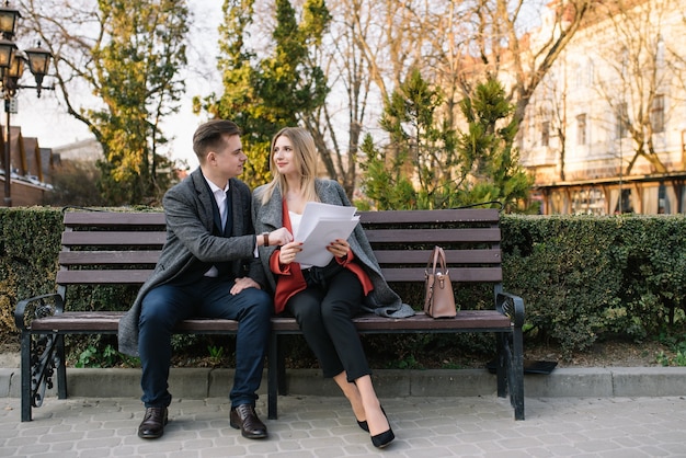 Business people sitting on a bench