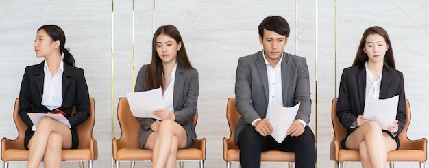 Business people sitting on chairs during interview