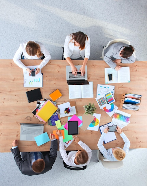 business people sitting and discussing at business meeting in office