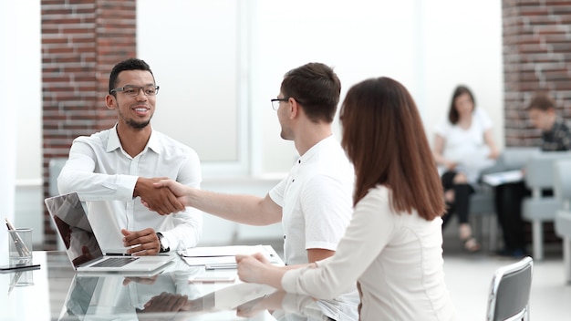 Business people sitting in the lobby of the business center . concept of partnership