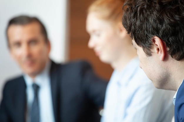 Business people sitting in a row