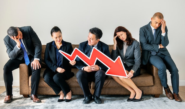 Photo business people sitting together with statistics icon