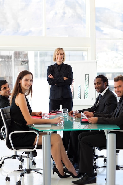 Business people smiling at the camera in a meeting