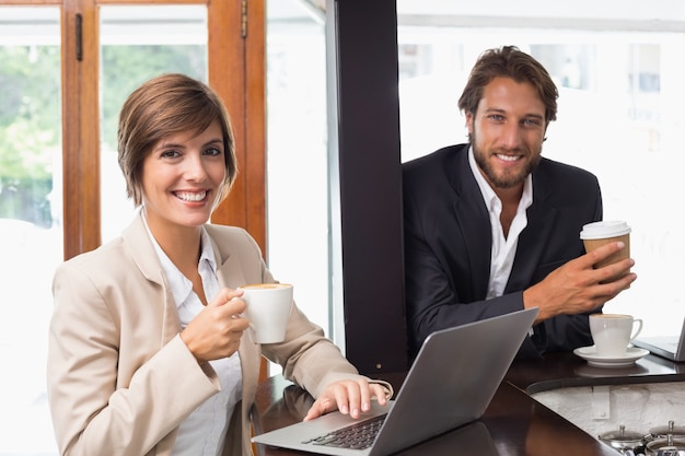 Business people smiling at the camera