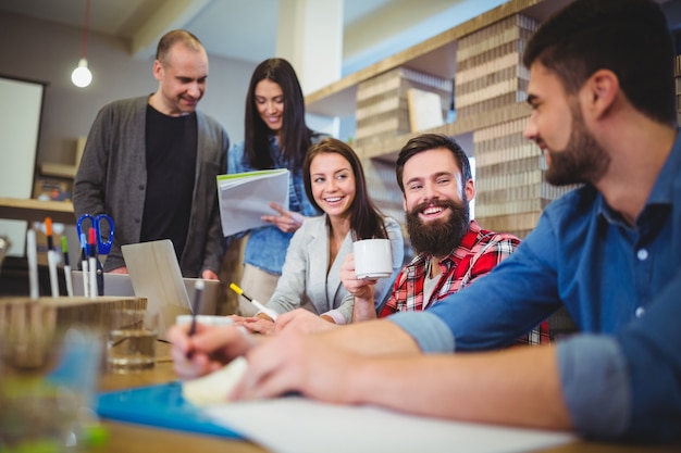 Business people smiling during meeting