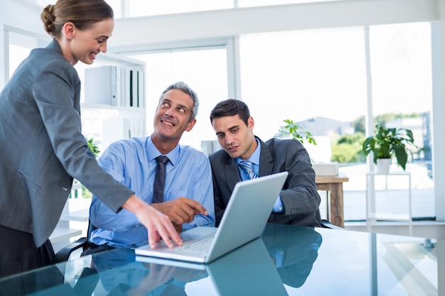 Business people speaking together during meeting 