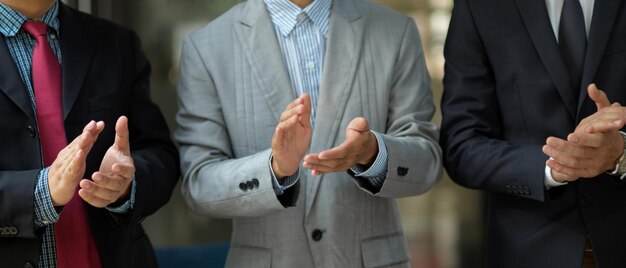 Business people stacking hands