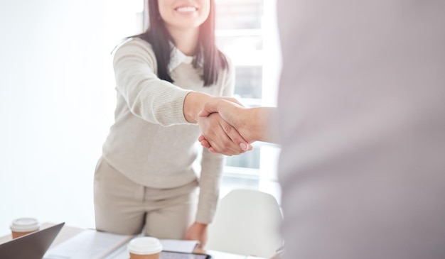 Business people staff and handshake in a meeting cooperation and partnership with teamwork Closeup woman and coworkers shaking hands collaboration or agreement with welcome support or thank you