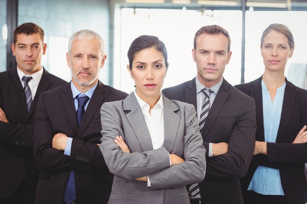 business people standing with arms crossed