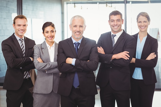 business people standing with arms crossed