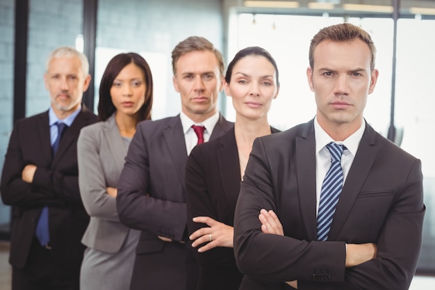 business people standing with arms crossed