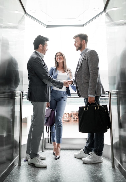 Business people stretching out their hands for a handshakeconcept of partnership