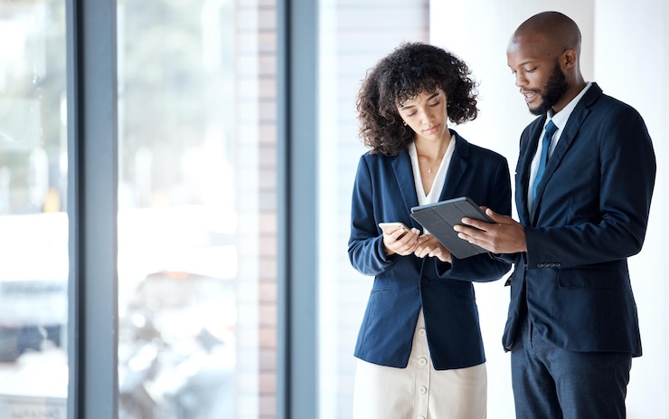 Photo business people tablet and checking data in digital marketing corporate data or networking at the office employee man and woman with touchscreen in planning for company idea or market strategy
