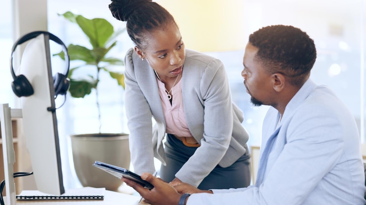 Photo business people tablet and man with black woman telemarketing and planning in a workplace tech support employee or manager with call center meeting or customer service with tech internet or crm