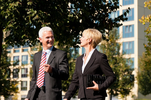 Business people talking outdoors