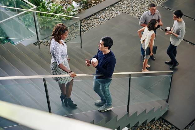 business people talking on stairs