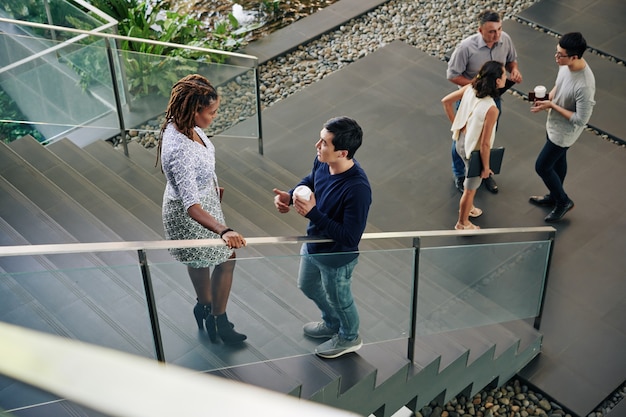 Business people talking on stairs