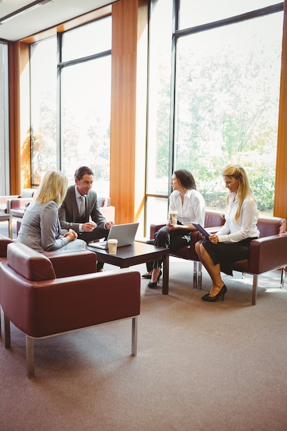 Business people talking and working together on sofa