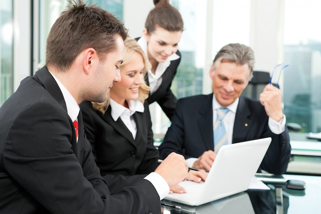 Business people - team meeting in an office