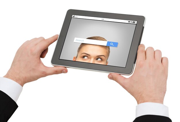 business, people and technology concept - close up of man hands holding tablet pc computer with internet browser search bar on screen