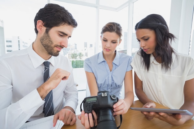 Business people using a camera