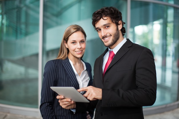 Business people using a digintal tablet