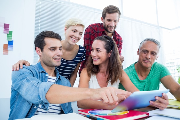 Business people using digital tablet in office