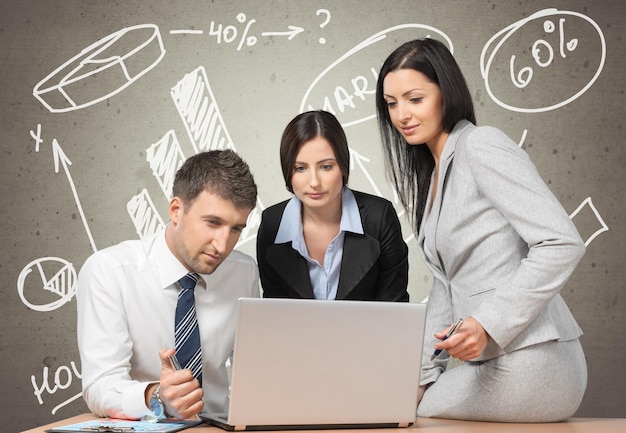 Business people using laptop on background