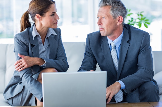 Business people using laptop computer