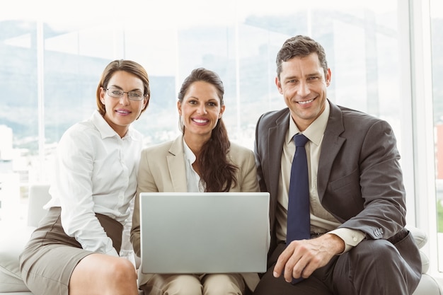 Business people using laptop