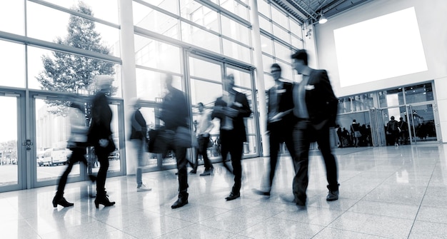 business people walking at a business center, including copy space banner. ideal for websites and magazines layouts