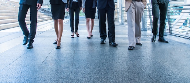 Business people walking in city.