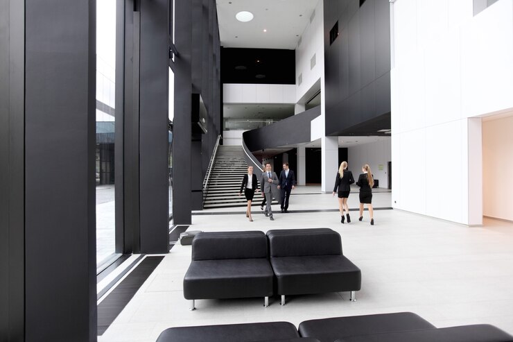 Photo business people walking in the lobby of modern building