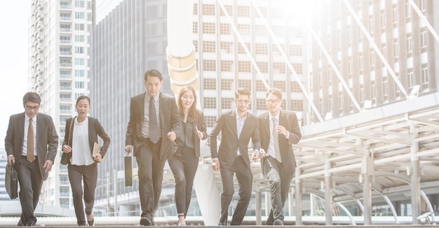 business people walking on steps in city