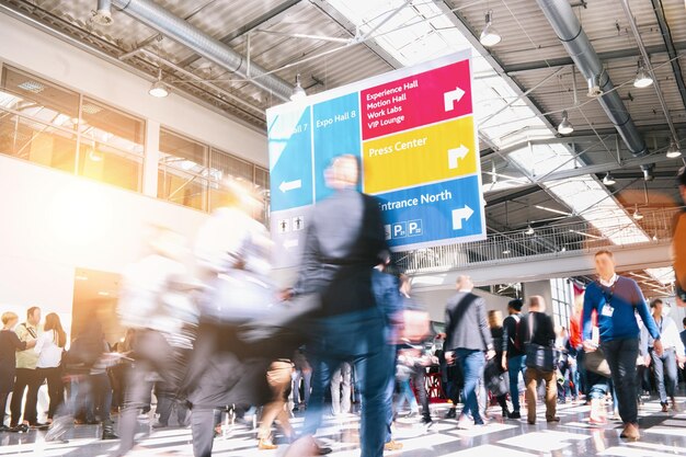 Business people walking on a trade show hall