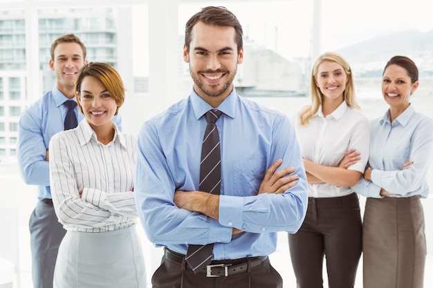 Business people with arms crossed in office