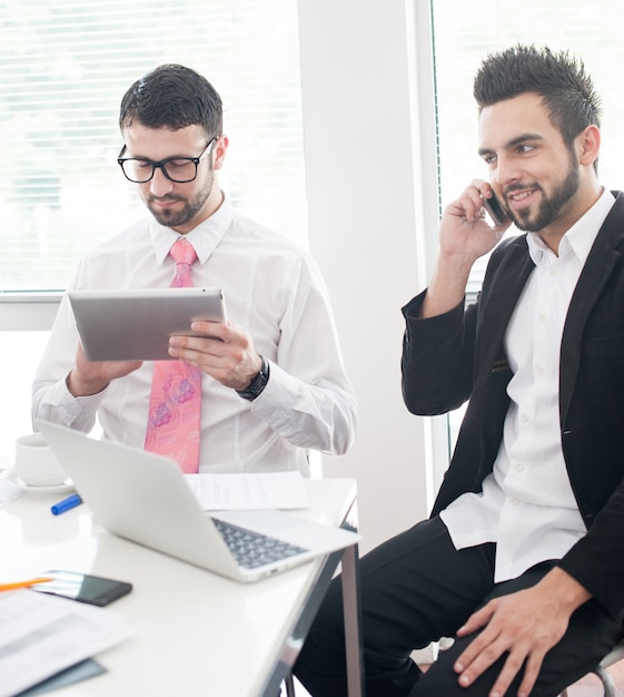 Business people with tablet working in office