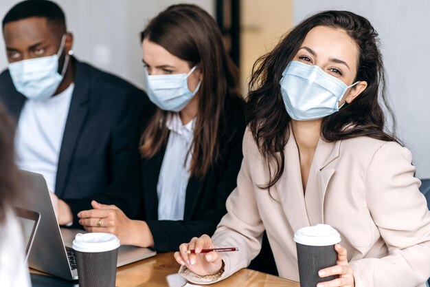 Photo business people work woman man team medical mask