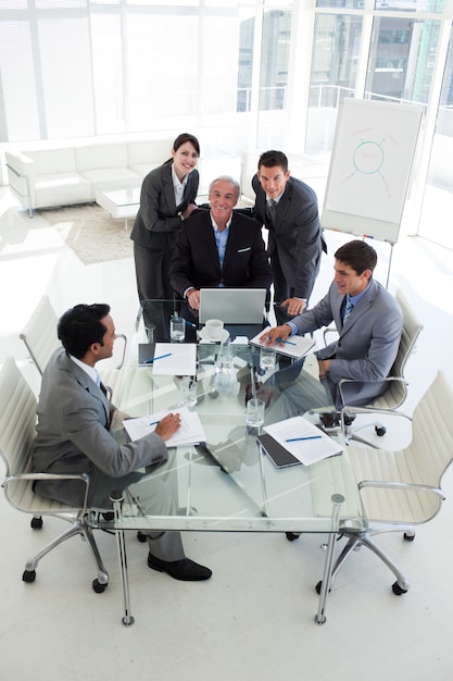 Business people working at a computer in a meeting