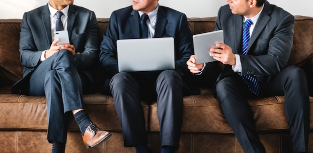 Business people working on gadgets