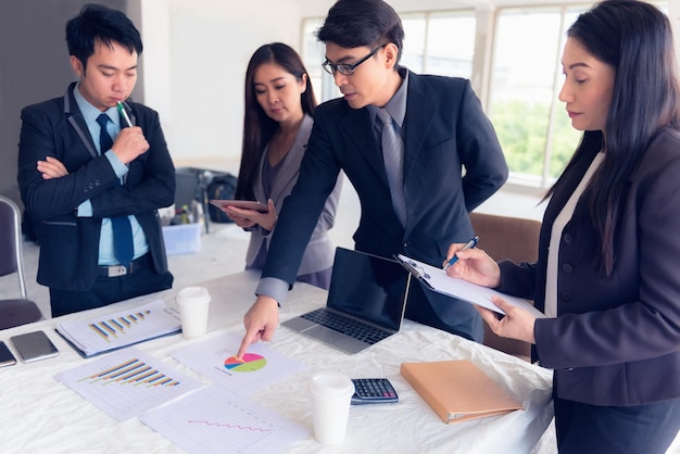 business people working over graph at office