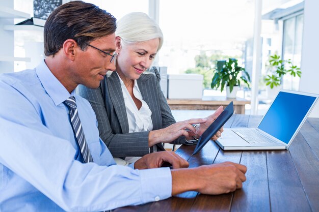 Business people working on tablet computer 