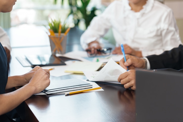 Photo business people working together at conference table