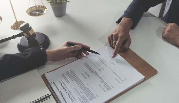 Business people working together at meeting in modern office closeup Businessman and woman with colleagues or lawyers discussing contract at negotiation