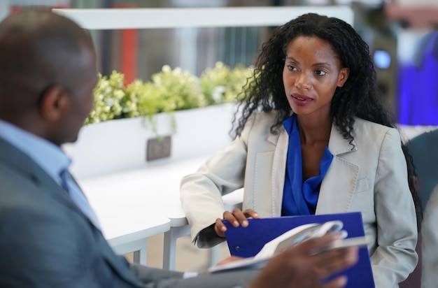 Business people in the workplace are discussing a working\
strategy for doing business